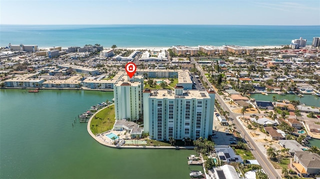 birds eye view of property with a view of city and a water view