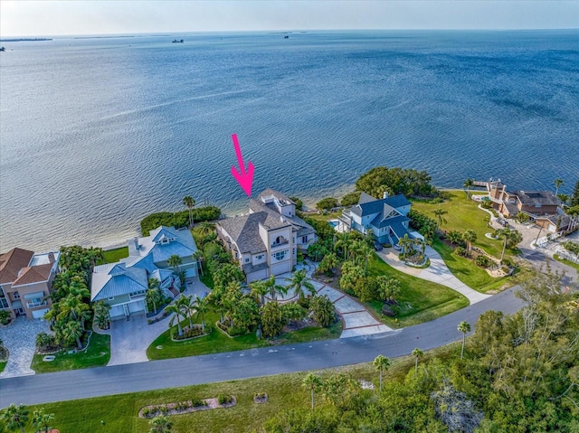 birds eye view of property featuring a water view and a residential view