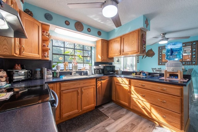 kitchen featuring a textured ceiling, ceiling fan, a sink, stainless steel dishwasher, and range hood