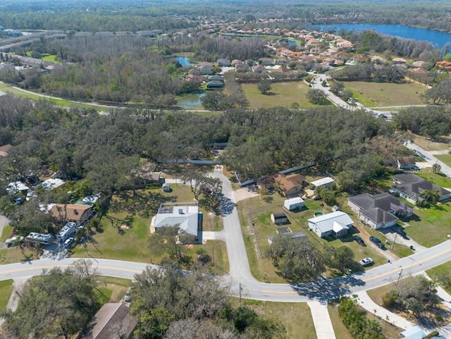 drone / aerial view featuring a residential view and a water view