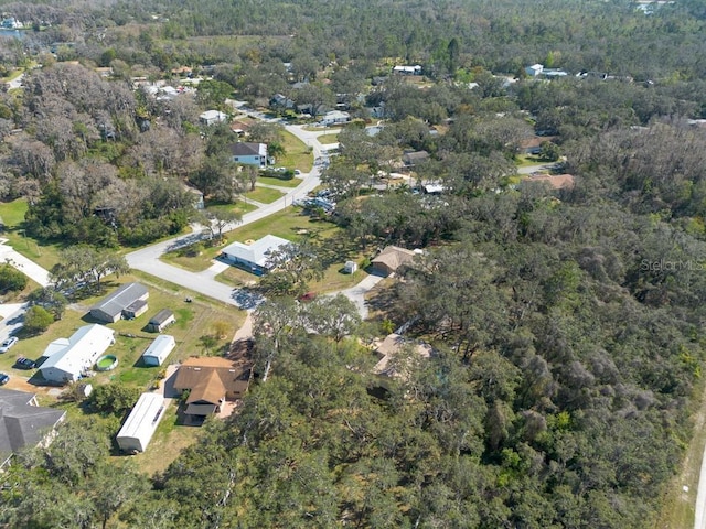 bird's eye view featuring a view of trees