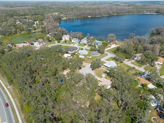 aerial view with a water view, a forest view, and a residential view