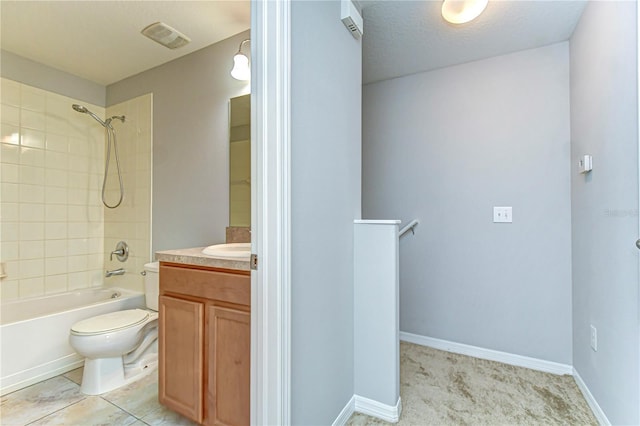 bathroom with shower / tub combination, toilet, vanity, visible vents, and baseboards