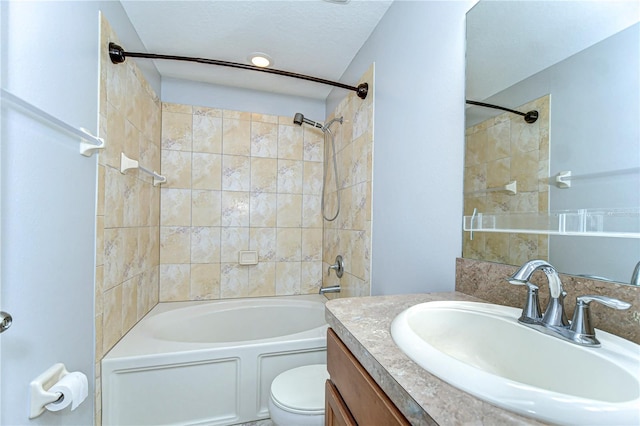 full bath featuring a textured ceiling, vanity, toilet, and shower / bathtub combination