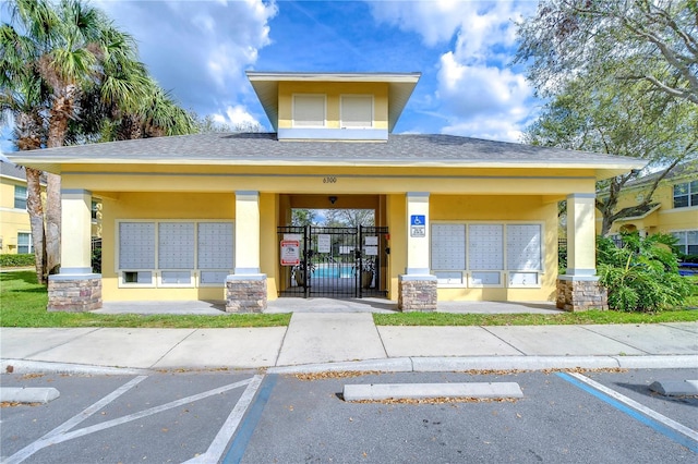 view of property with uncovered parking