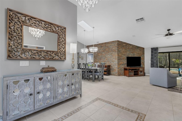 interior space with high vaulted ceiling, visible vents, a notable chandelier, and tile patterned floors