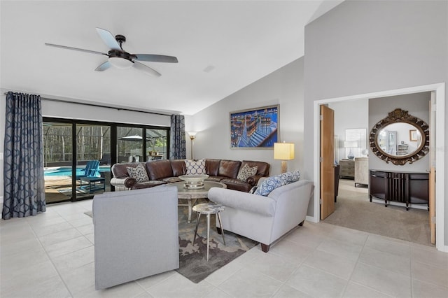 living room featuring light tile patterned floors, ceiling fan, high vaulted ceiling, and light colored carpet