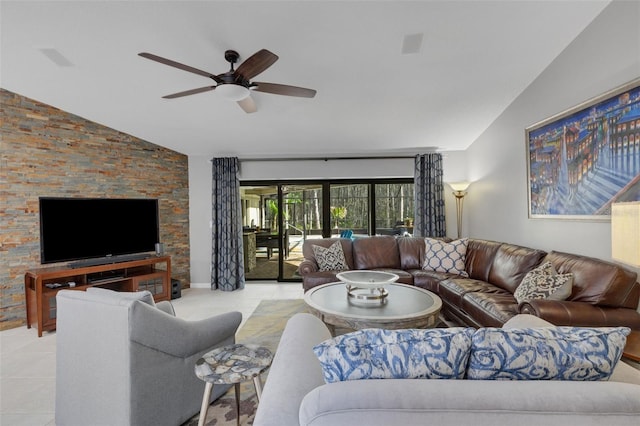 tiled living area with lofted ceiling and ceiling fan