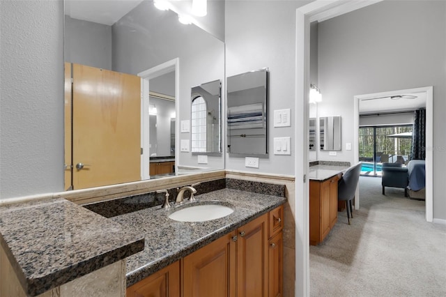 bathroom with ensuite bathroom and vanity