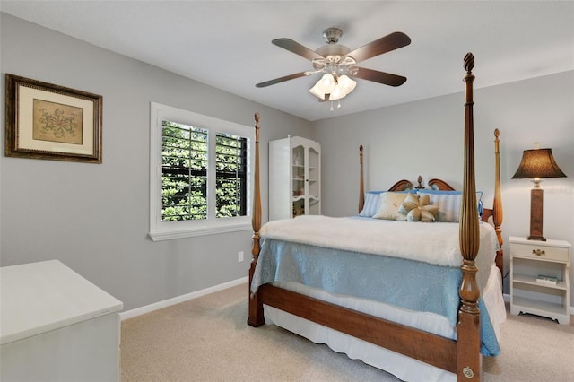 bedroom with carpet floors, ceiling fan, and baseboards