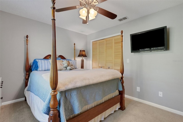 bedroom with carpet floors, baseboards, visible vents, and a closet