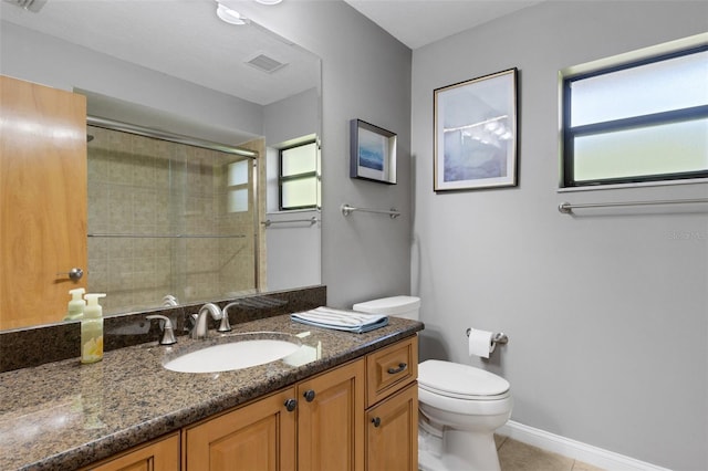 full bath featuring visible vents, toilet, tile patterned floors, a tile shower, and vanity