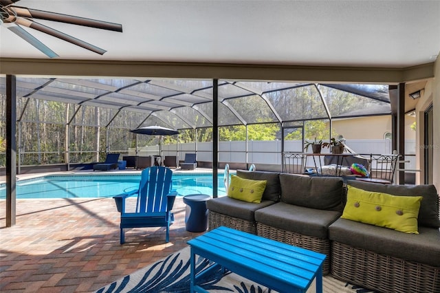 view of patio / terrace featuring a lanai, fence, an outdoor living space, and a fenced in pool