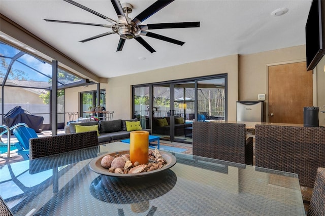 sunroom with a ceiling fan