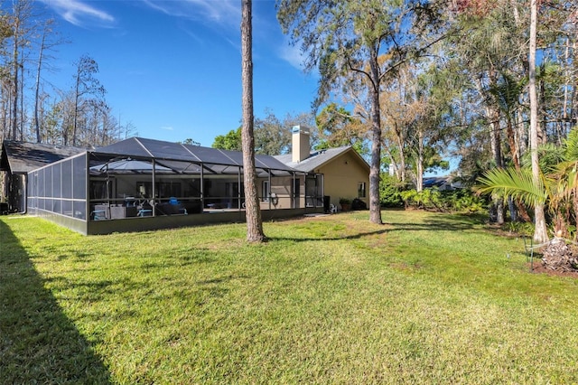 view of yard with a lanai