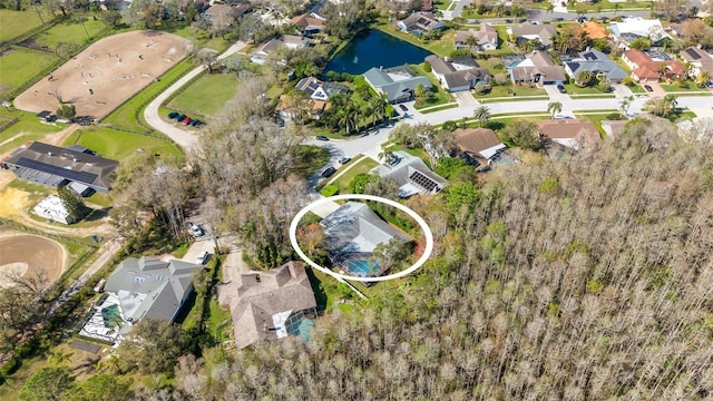 birds eye view of property featuring a residential view and a water view