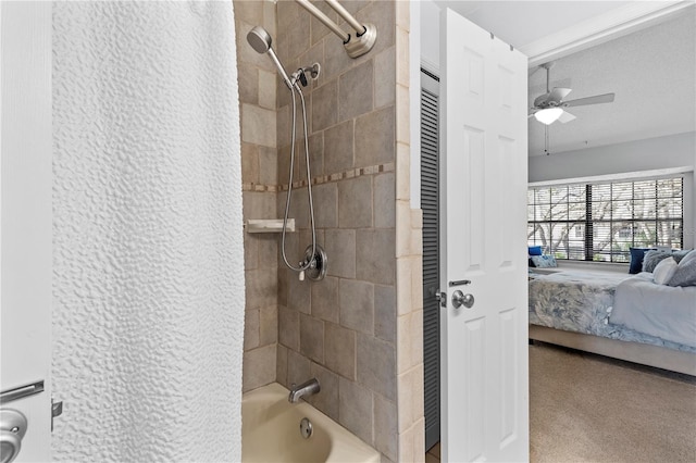 ensuite bathroom with a ceiling fan, shower / tub combo with curtain, and ensuite bathroom