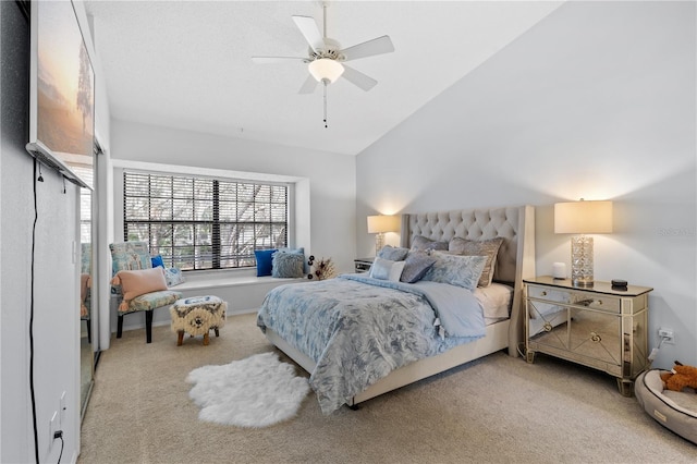 bedroom featuring vaulted ceiling, ceiling fan, and carpet