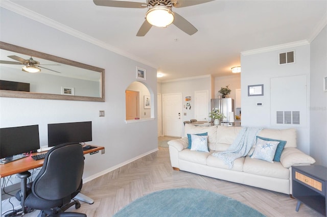 office space with visible vents, crown molding, baseboards, and ceiling fan