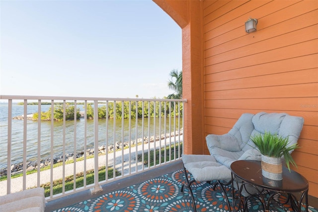 balcony featuring a water view