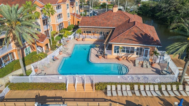 pool featuring fence and a patio