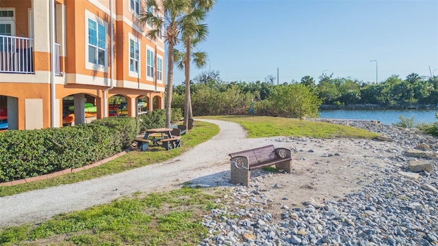 surrounding community with a water view