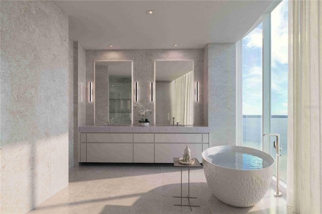 full bathroom with double vanity, a sink, a wall of windows, a freestanding tub, and tile patterned floors