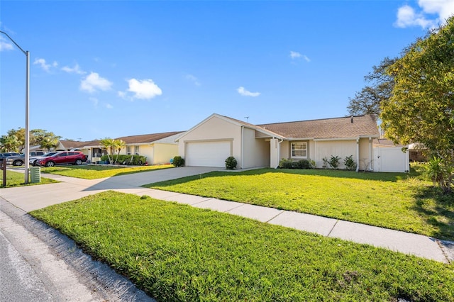 ranch-style house featuring stucco siding, a garage, concrete driveway, and a front yard