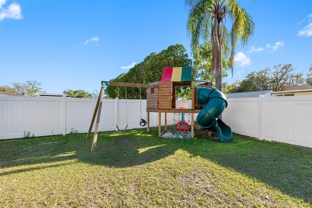 view of play area with a yard and a fenced backyard