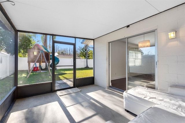 unfurnished sunroom with plenty of natural light