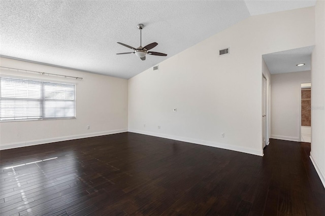 empty room with visible vents, a ceiling fan, a textured ceiling, wood finished floors, and vaulted ceiling