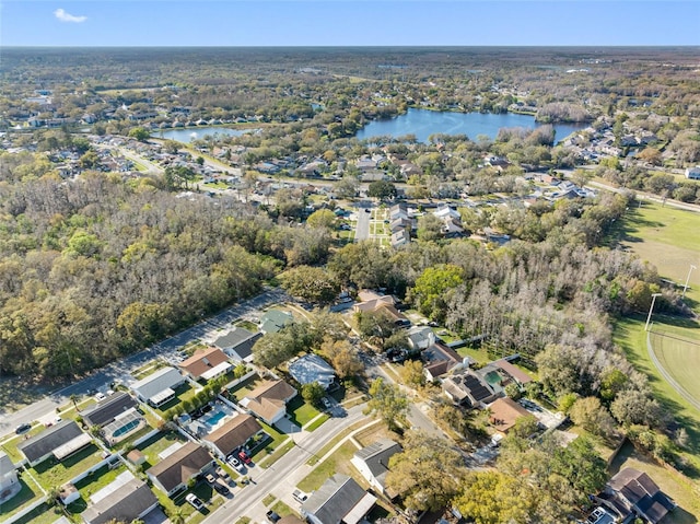 drone / aerial view featuring a water view and a residential view