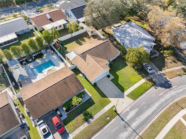 birds eye view of property with a residential view