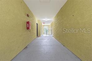 hallway with a textured wall