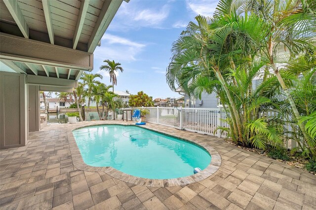 17404 1st St E, Redington Shores, FL 33708 - view of pool featuring a fenced backyard and a patio