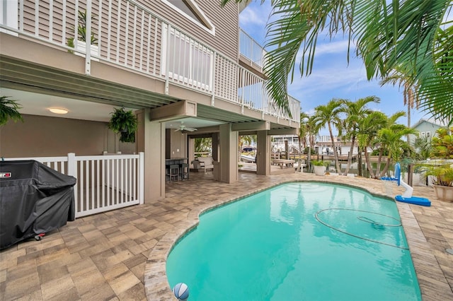 17404 1st St E, Redington Shores, FL 33708 - outdoor pool with a patio, a ceiling fan, and a grill