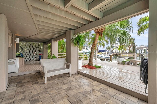17404 1st St E, Redington Shores, FL 33708 - view of patio with a deck with water view