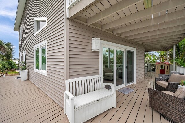 17404 1st St E, Redington Shores, FL 33708 - wooden deck with an outdoor hangout area