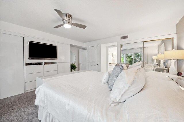 17404 1st St E, Redington Shores, FL 33708 - bedroom with carpet, ceiling fan, and ensuite bath