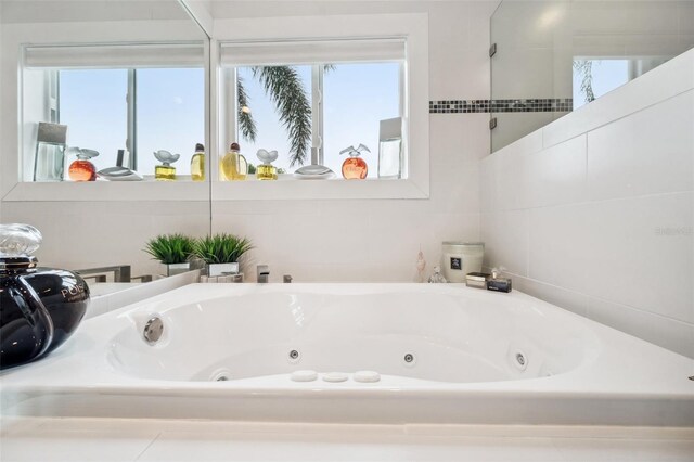 17404 1st St E, Redington Shores, FL 33708 - bathroom with plenty of natural light and a whirlpool tub