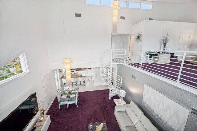 17404 1st St E, Redington Shores, FL 33708 - living room with a towering ceiling and carpet flooring