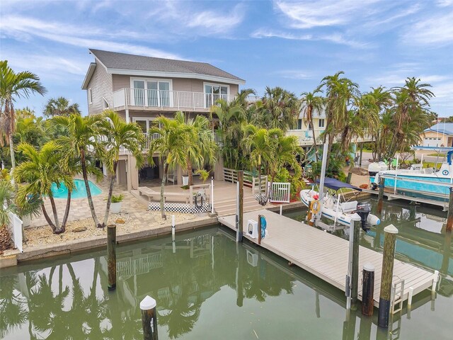 17404 1st St E, Redington Shores, FL 33708 - dock featuring a balcony, boat lift, and a water view