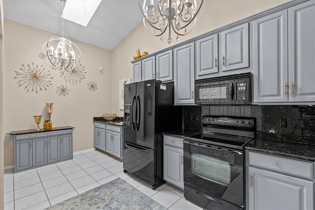 kitchen featuring a chandelier, black appliances, tasteful backsplash, and gray cabinetry