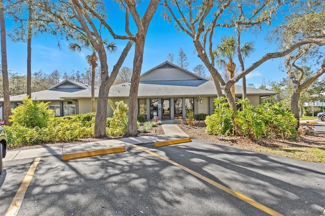 view of property featuring uncovered parking