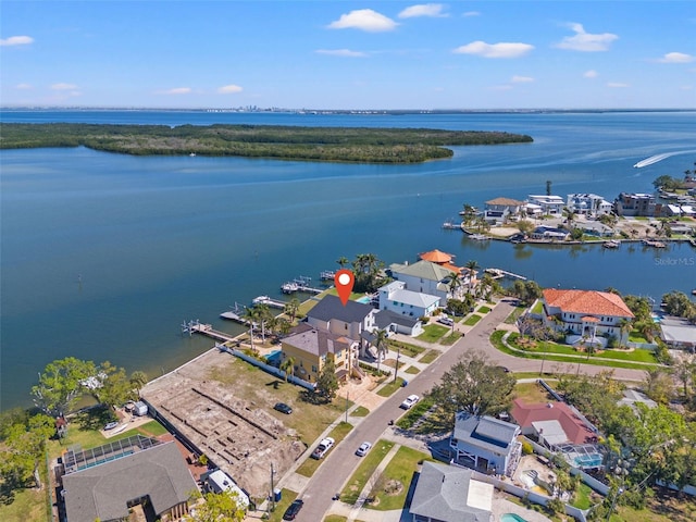 drone / aerial view with a water view and a residential view