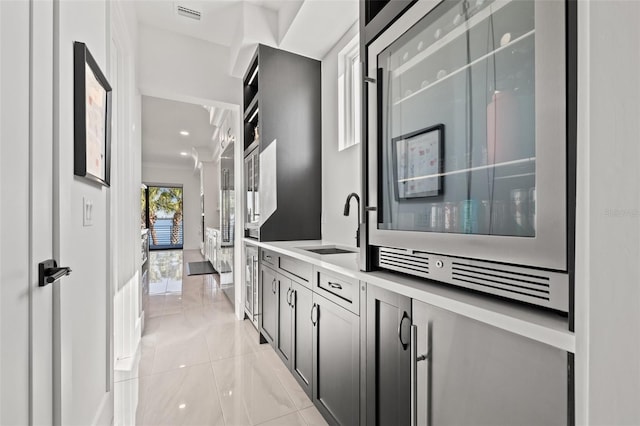 interior space with visible vents, vanity, and crown molding