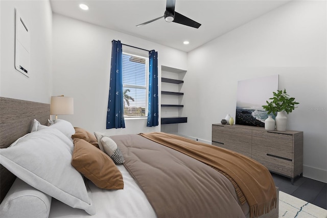 bedroom featuring recessed lighting, baseboards, wood finished floors, and a ceiling fan