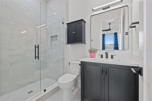 full bathroom with a shower stall, toilet, and vanity