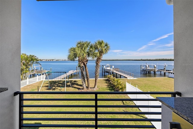 exterior space featuring a boat dock and a water view