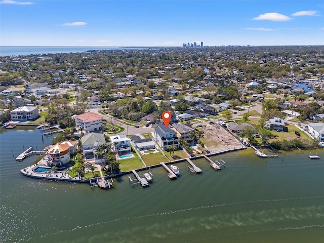 birds eye view of property with a water view